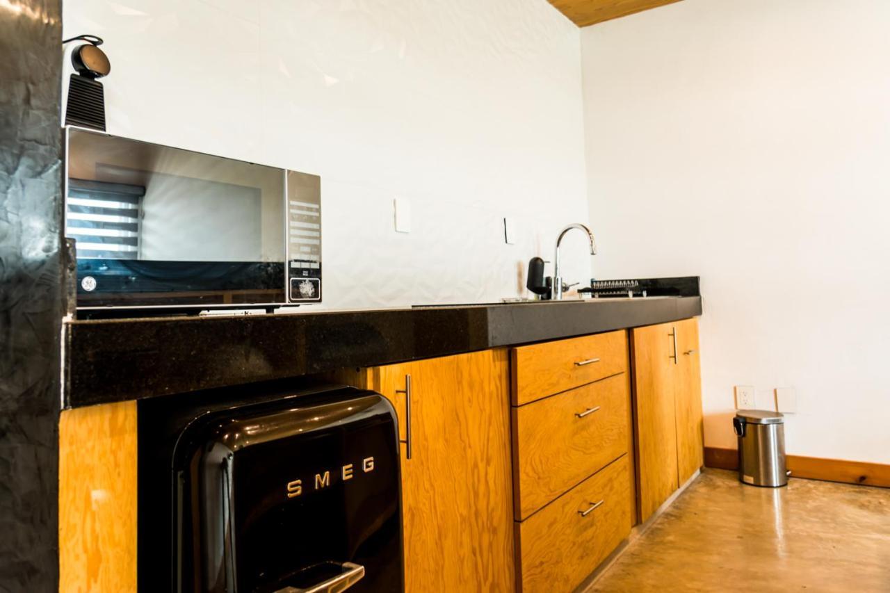 Casa Ticul Hotel Boutique - 5Th Ave (Adults Only) 普拉亚卡门 外观 照片 A kitchen with a refrigerator, stove, and oven